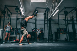 male athlete doing handstand walk