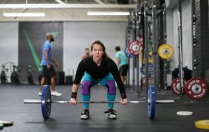 Female athlete in the set-up position for the clean.