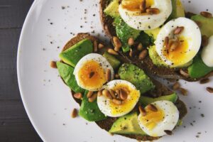 Delicious looking avocado toast with eggs, which might fit into your macros!